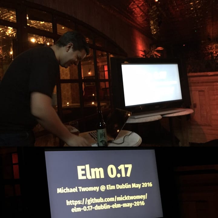 Photo of Michael presenting his slides in a dark pub